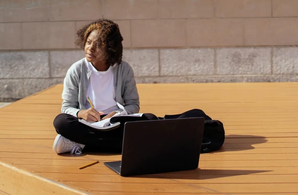 Student using AI tools on a laptop for studying