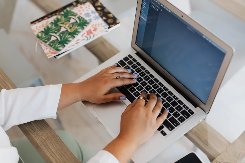 Writing an effective AI prompt on a laptop