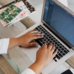 Writing an effective AI prompt on a laptop